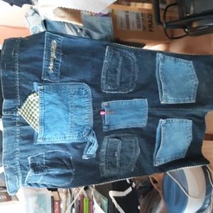 This is a home crafted wall hanging with pockets for storage of your supplies .